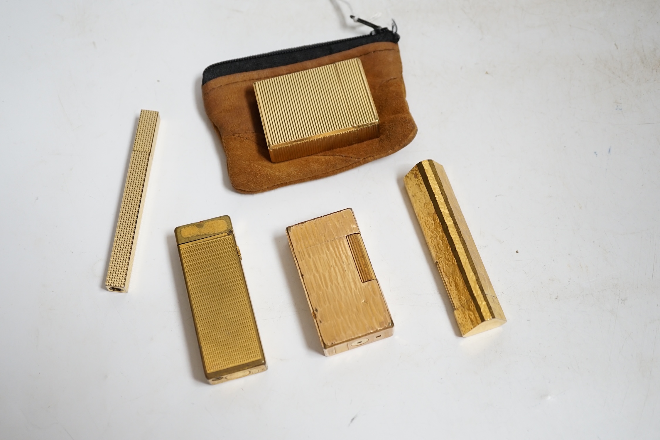 Two Dunhill gold plated lighters a Dupont lighter and two others. Condition - fair, not working.
